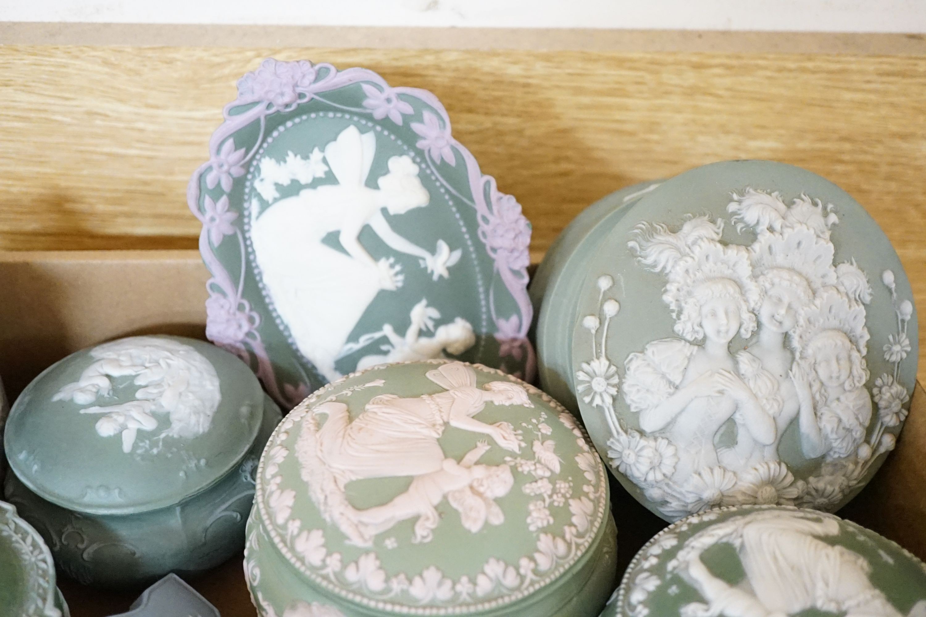 A collection of French bisque boxes and vases.